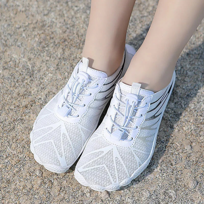 Low-top unisex casual sports running shoe in multiple colours with a lace-up front and rubber sole.