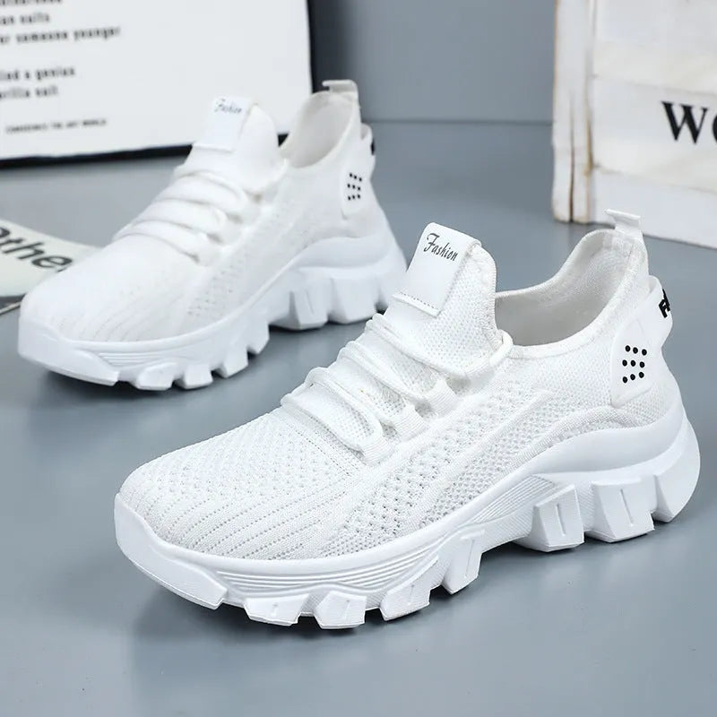 Women's white Flyknit sneaker with thick PVC sole and round toe lace-up design