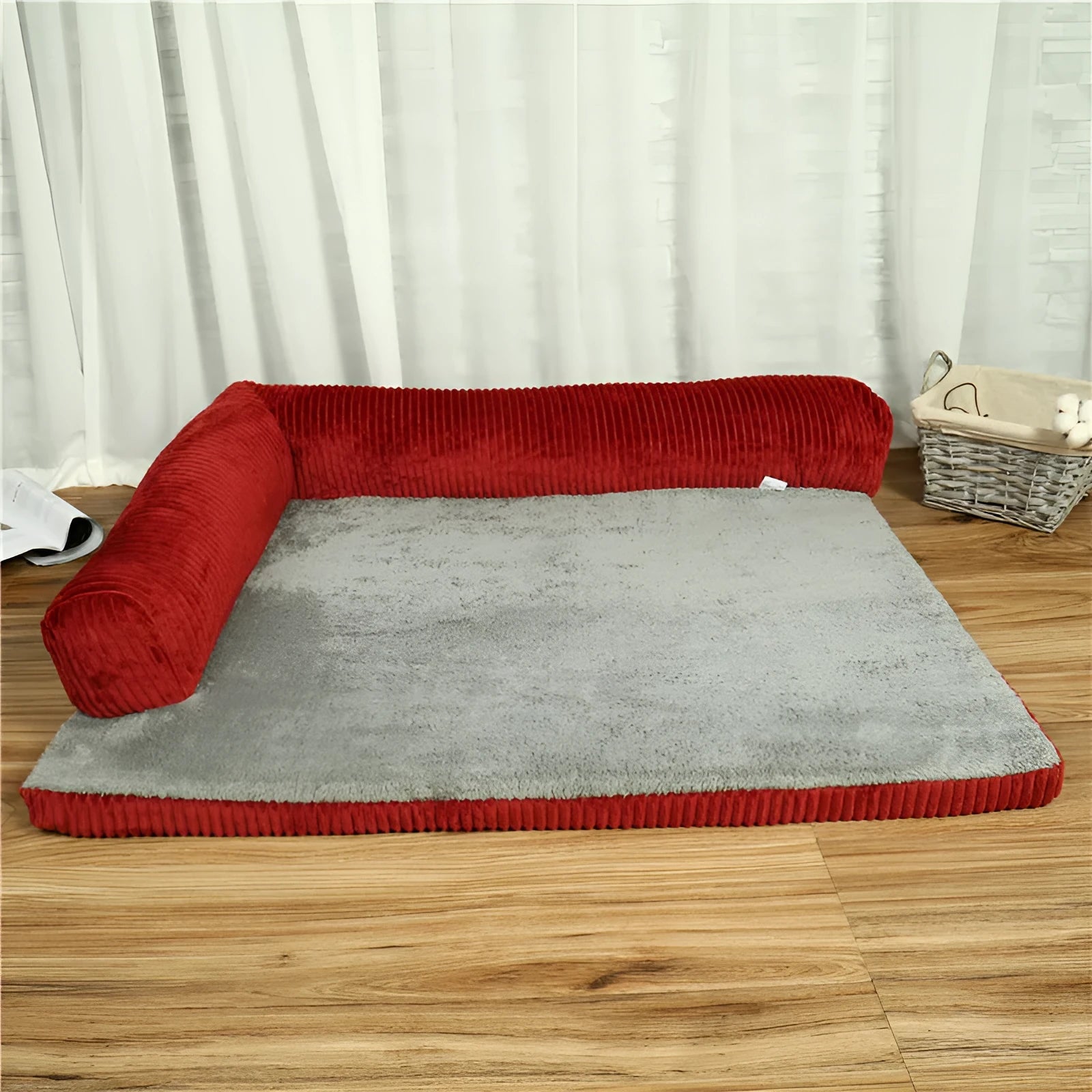 Corduroy dog bed sofa with bolster sides and non-slip base in a neutral colour.