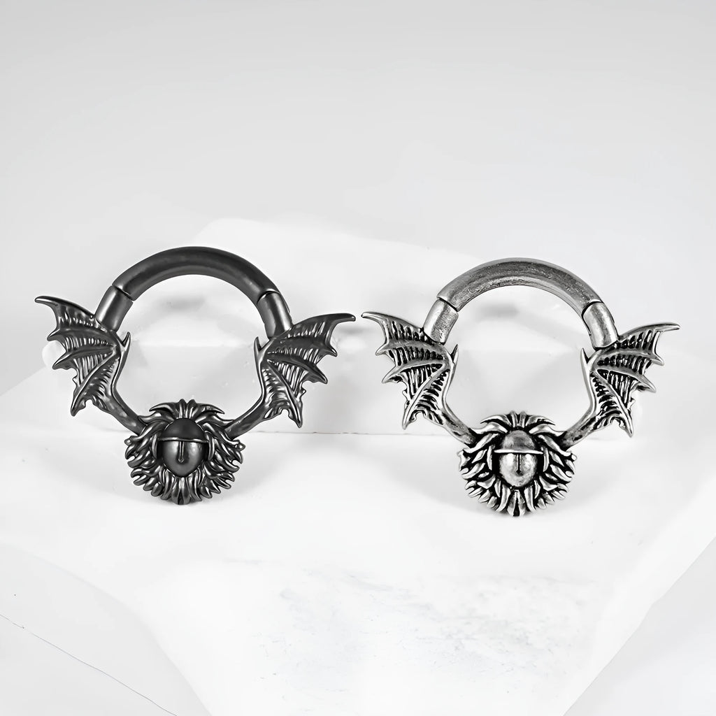 A pair of copper geometric cone and round shaped magnetic ear extenders on a white background.