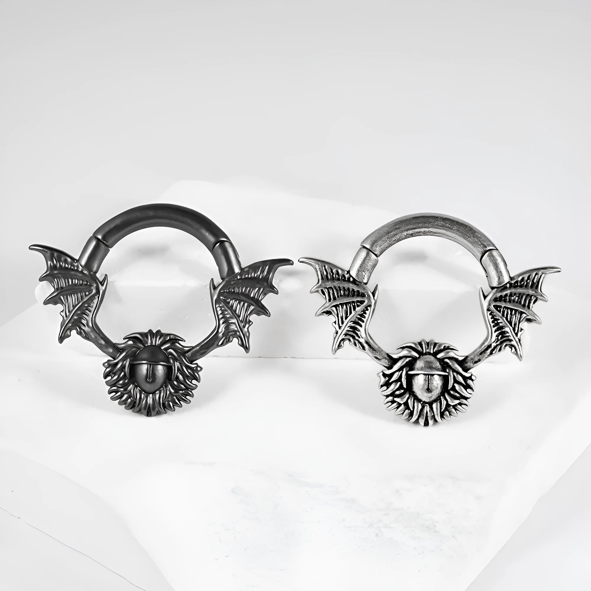A pair of copper geometric cone and round shaped magnetic ear extenders on a white background.