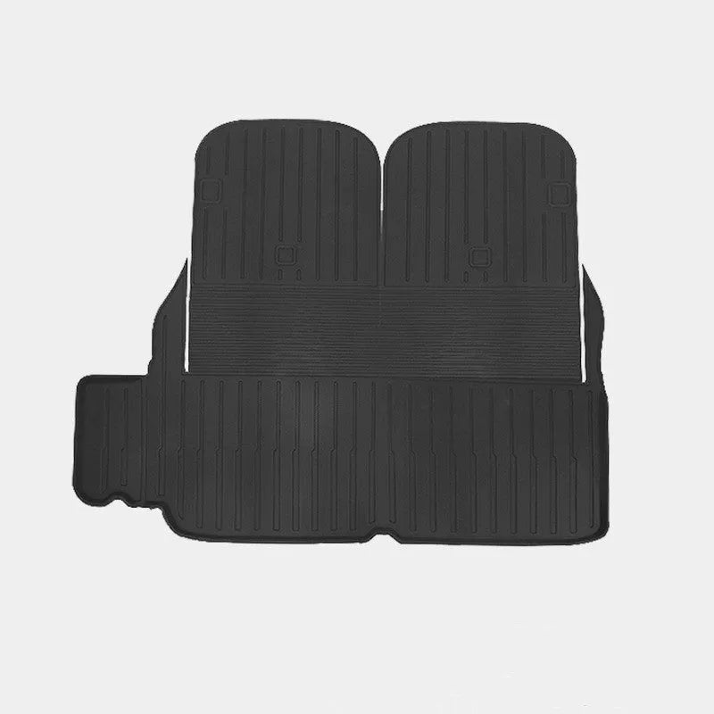 Tesla Model X black TPE rubber floor mats and boot liner set on car interior.