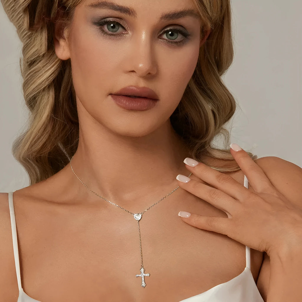 Simple sterling silver V-neck cross pendant necklace on an O-ring chain, colour BSN384.