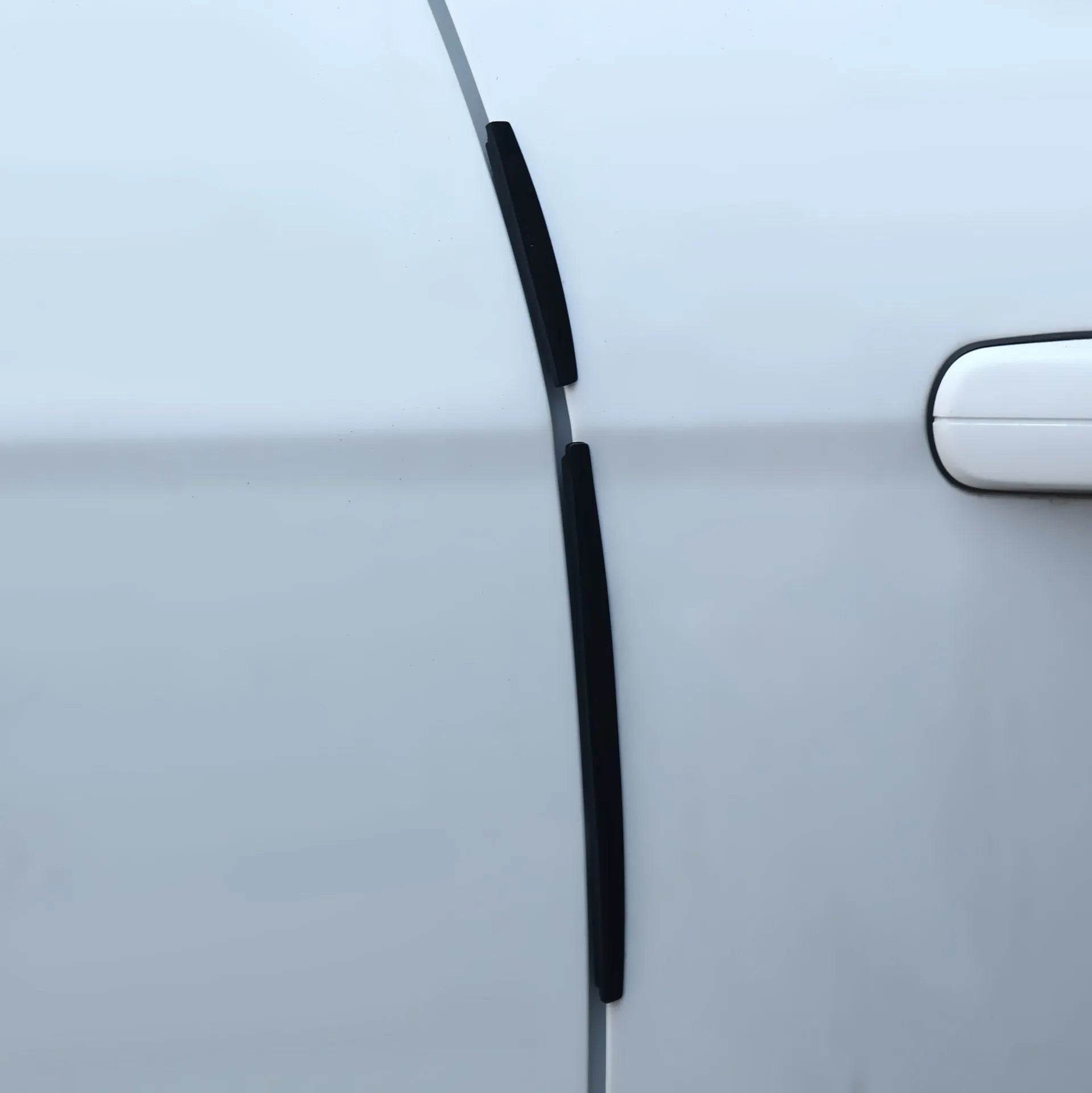 White plastic car door edge anti-collision bumper strip for general vehicle models.