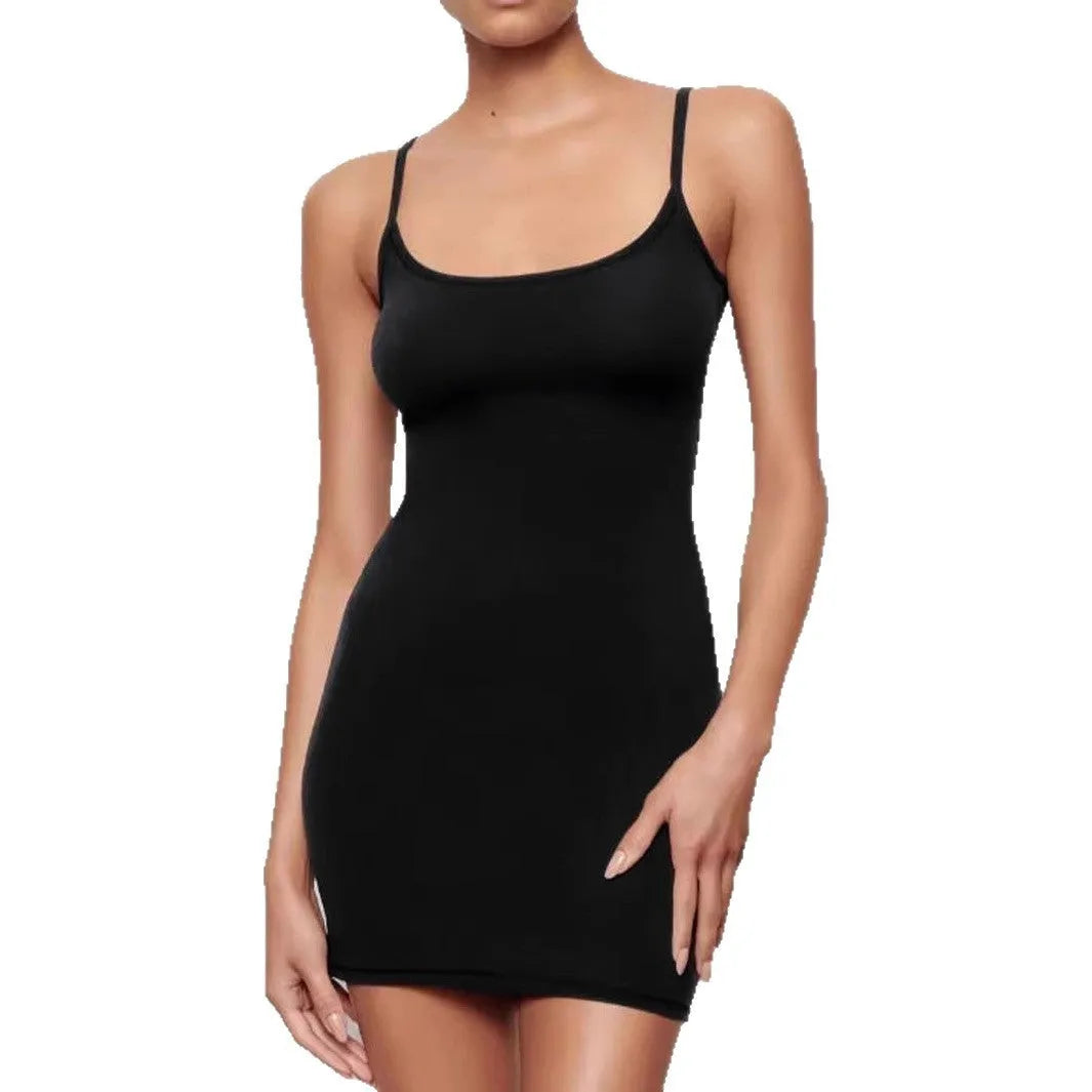 Black sleeveless sling dress with a short skirt and fitted sheath silhouette.