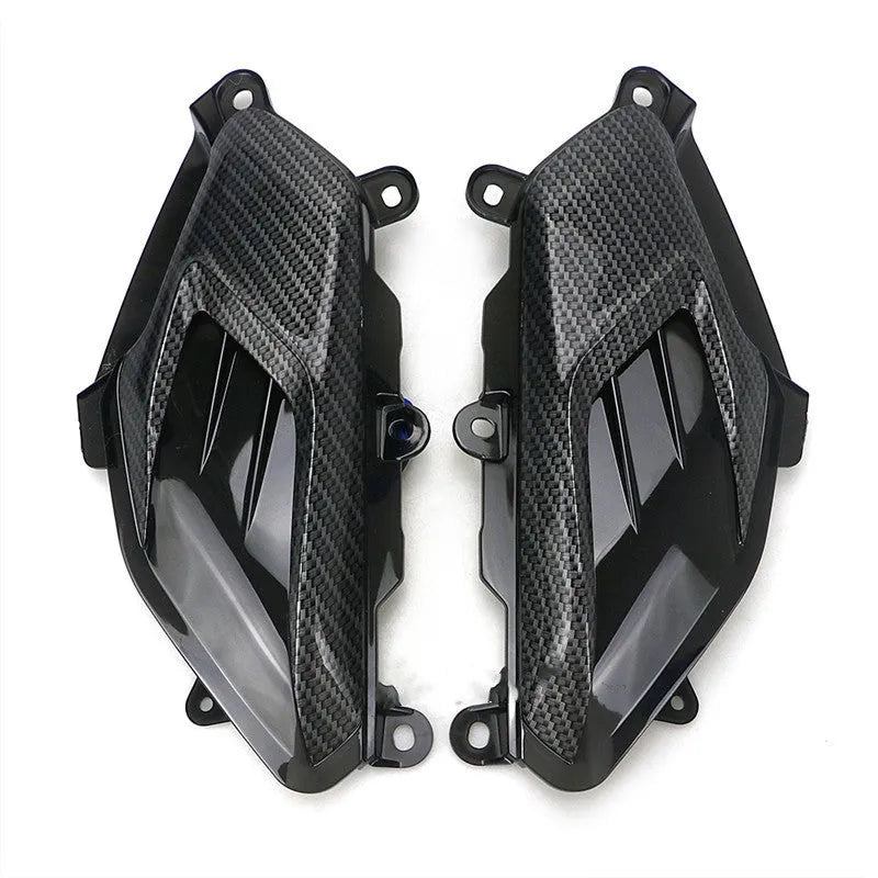 Pair of Yamaha NMAX replacement LED side lamps with carbon fibre decoration, showing blue or red light option.