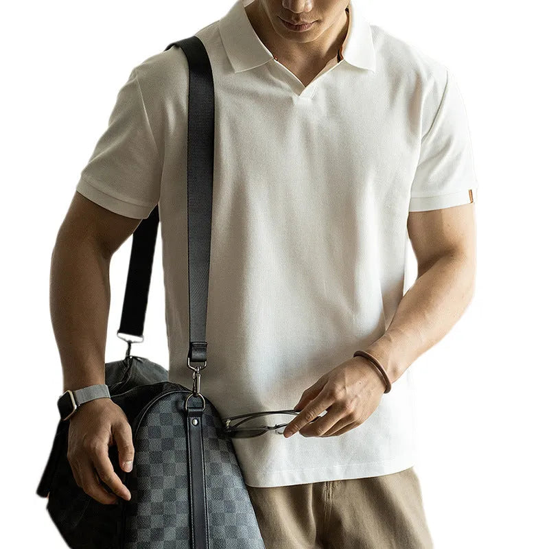Blue short-sleeved cotton blend polo shirt for men on a hanger, showing regular fit and button placket.