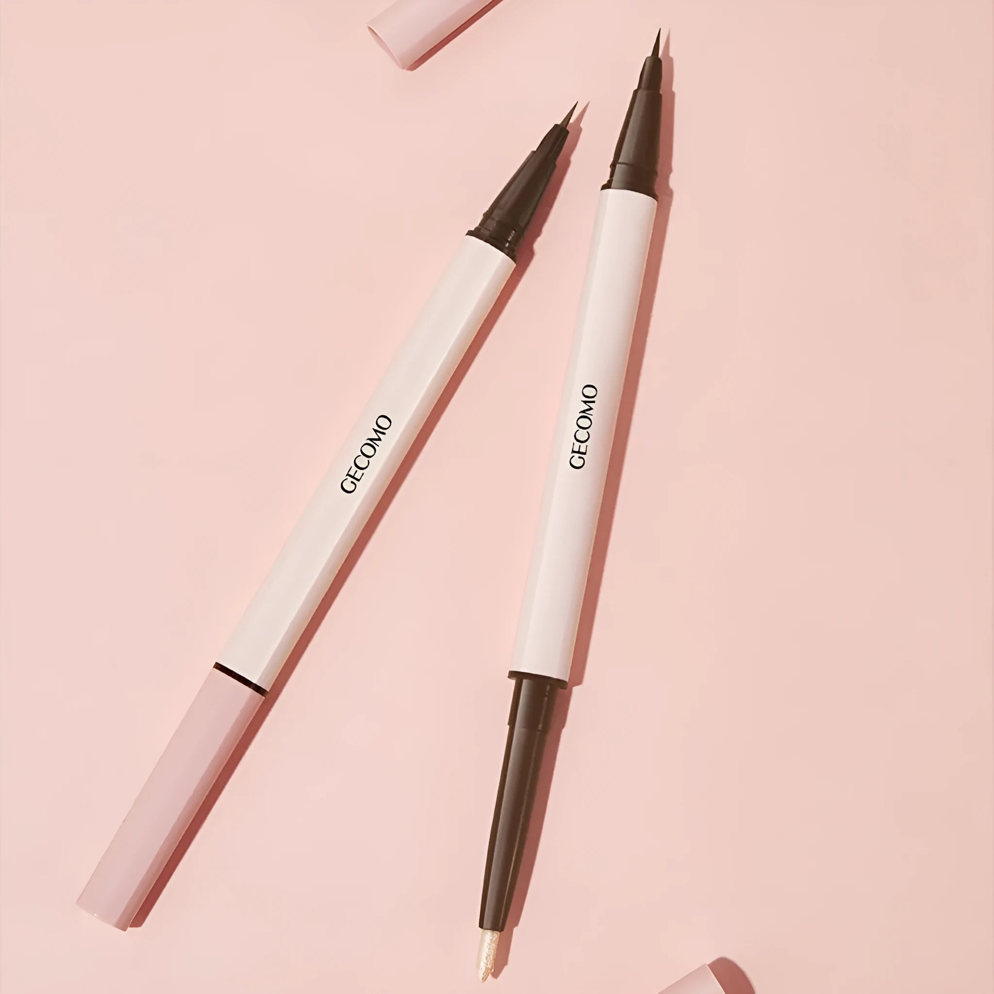 Double headed silkworm eyeliner pen in pearlescent floating platinum and born nude apricot shades