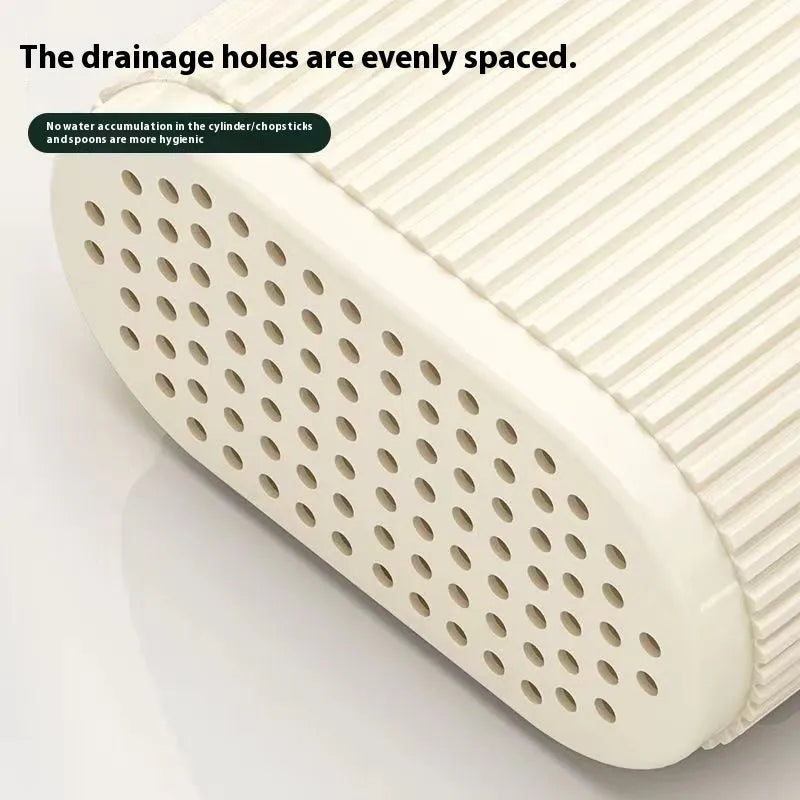Plastic wall-mounted chopstick and spoon basket in cross-bar design on kitchen wall