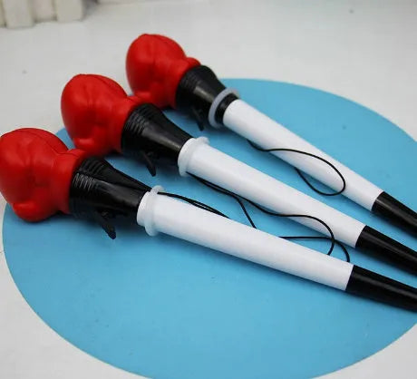 Boxing press ejection pen set showing four pens with plug-in sleeve mechanism and 0.7mm bullet-shaped tips
