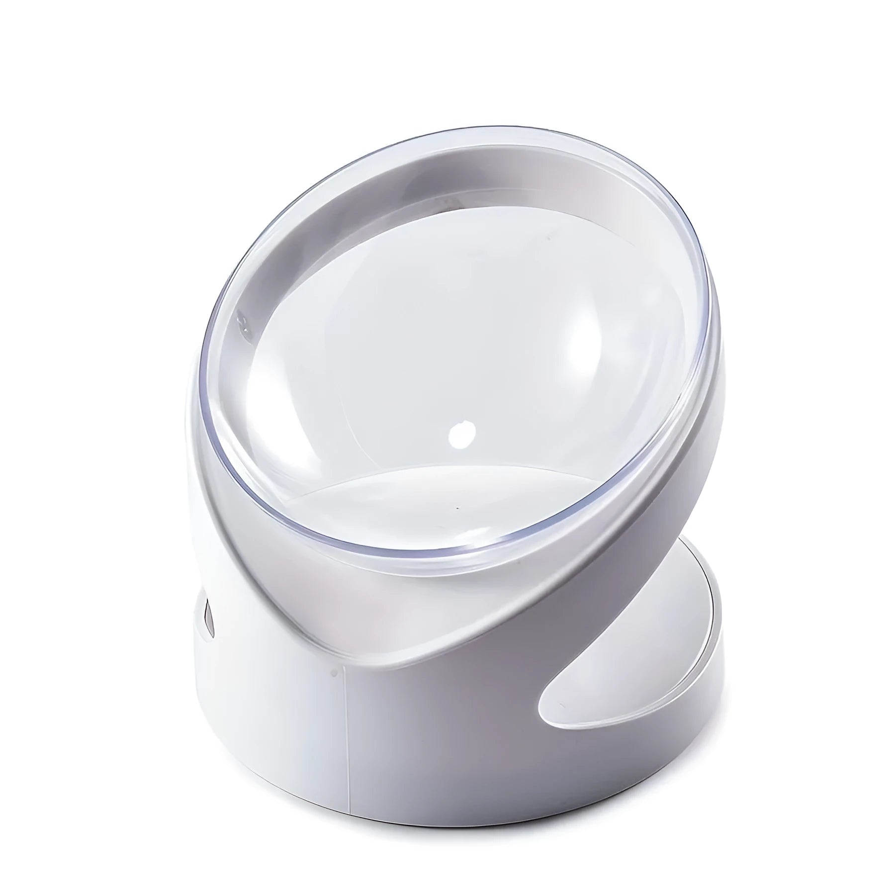 Clear plastic tilted cat food bowl on a flat surface