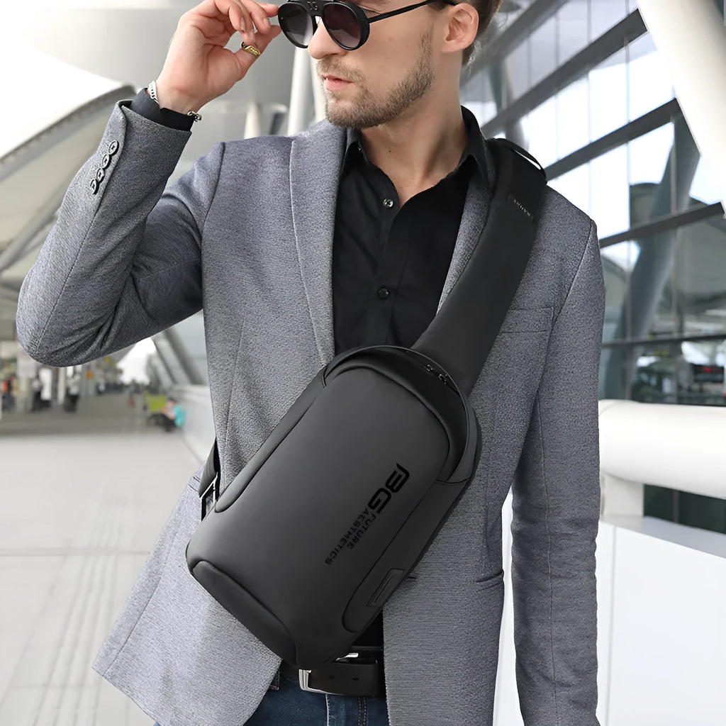 Men's black casual shoulder bag with USB port and Oxford cloth material for business travel.