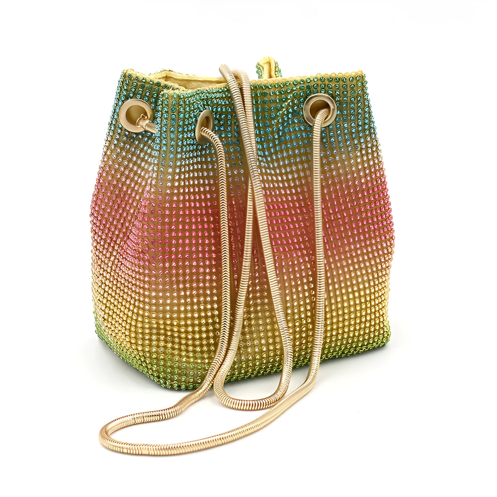 Colourful rhinestone fabric bucket bag with a sparkling jewelled shoulder strap on a white background