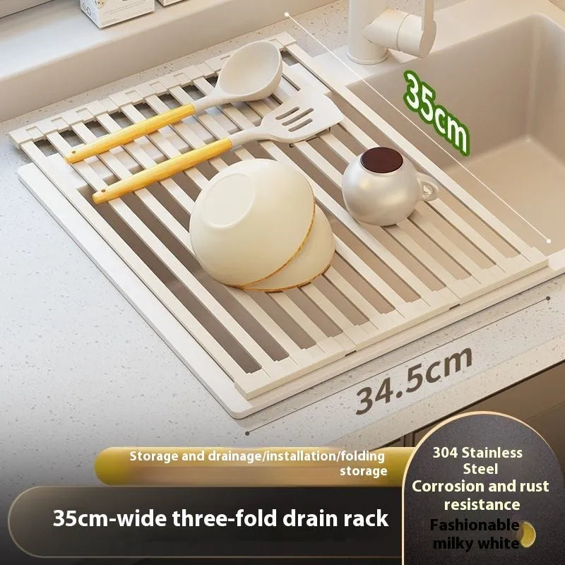 Milky white foldable stainless steel kitchen draining rack for dishes on a countertop