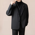 Man wearing a loose fit casual suit jacket in a light business style, available in apricot colour.