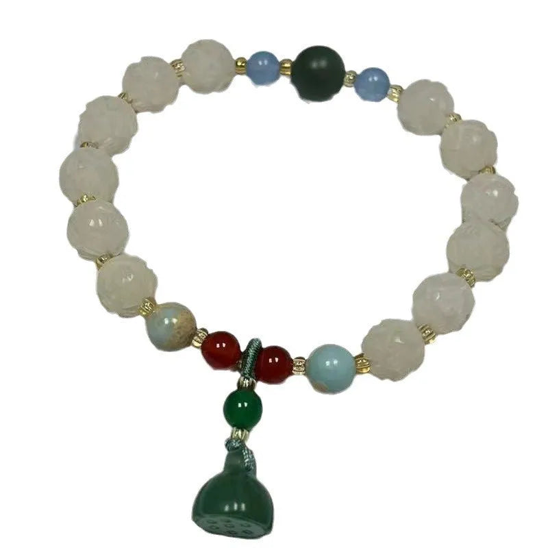 Carved pumpkin lotus bodhi root bracelet with white jade segments and golden silk jade treasures