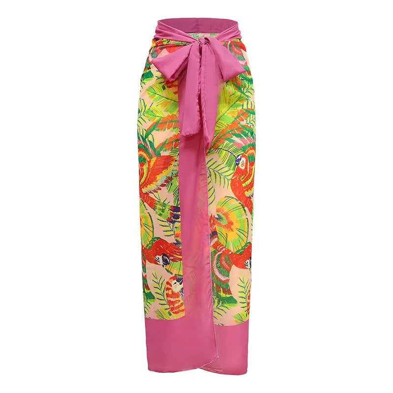 Women's pink floral print one-piece swimsuit with V-neck and a separate cover-up skirt.