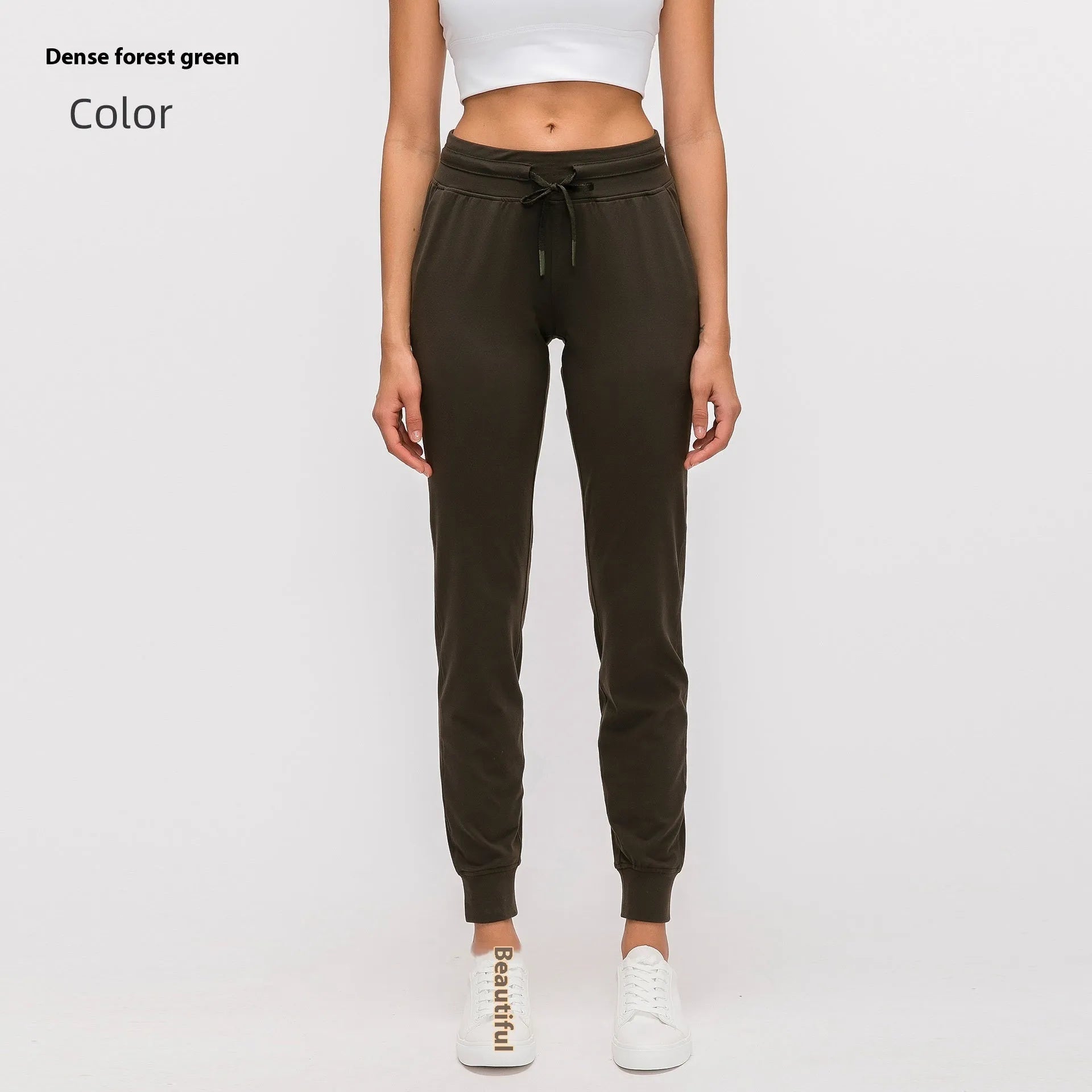 Women's high waist yoga pants in Belgian Blue colour with a drawstring waistband, shown flat.
