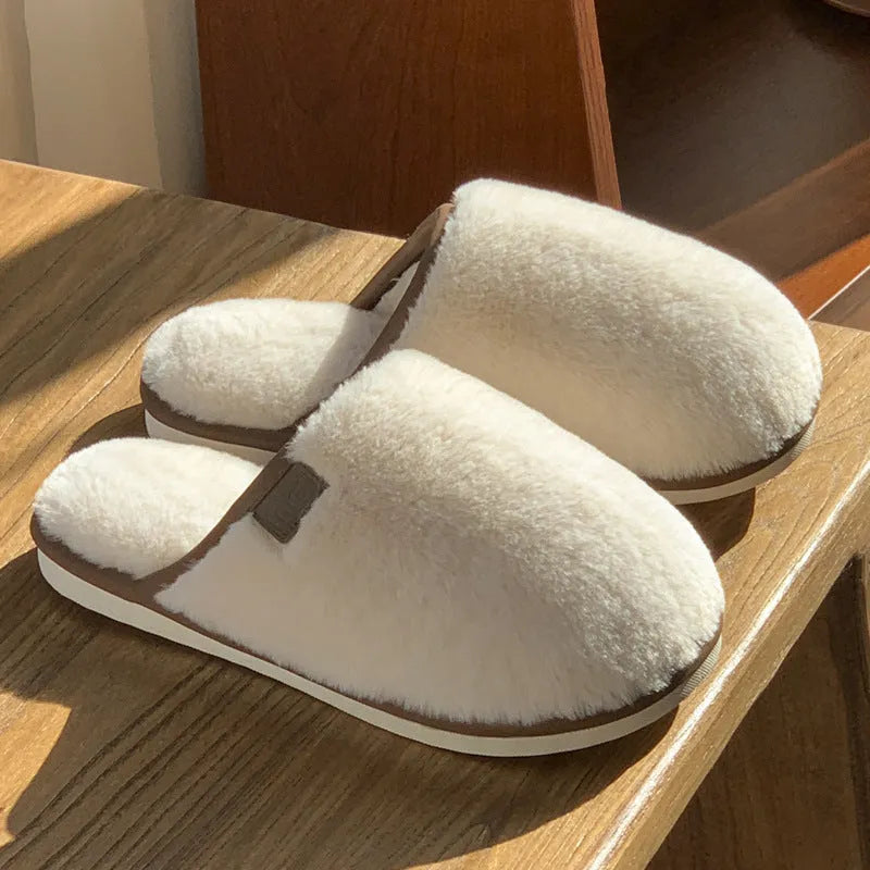 PVC non-slip winter slipper in a solid colour on a wooden floor.