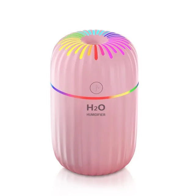 White pink or green mini USB humidifier with 300ml tank measuring 75x75x116mm