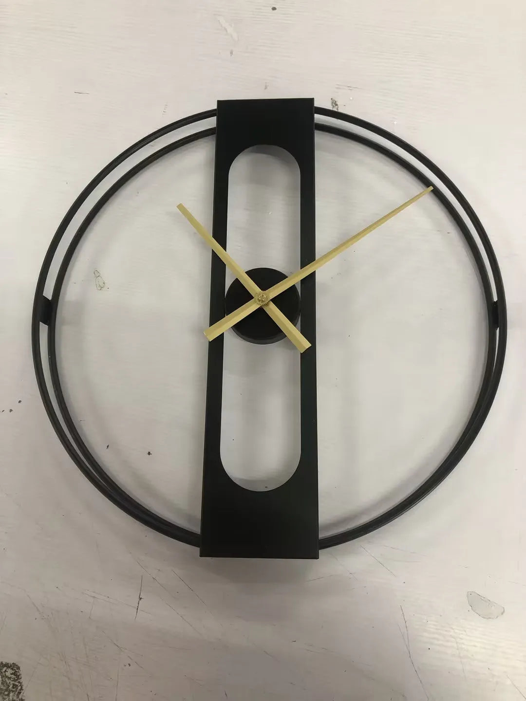 Round metal wall clock with 50cm diameter available in black or gold finish