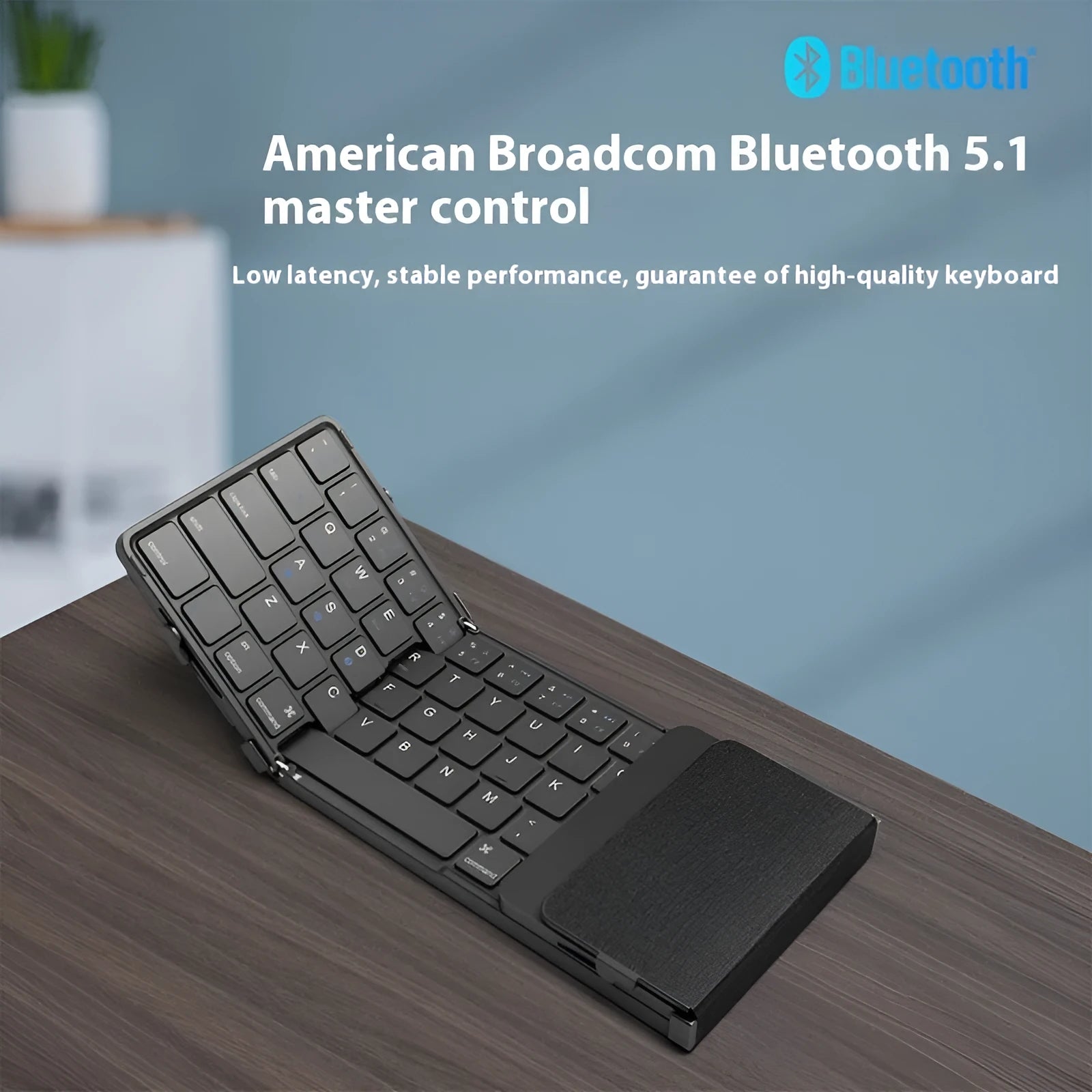Black folding Bluetooth keyboard for mobile phones and tablets showing compact 346mm size