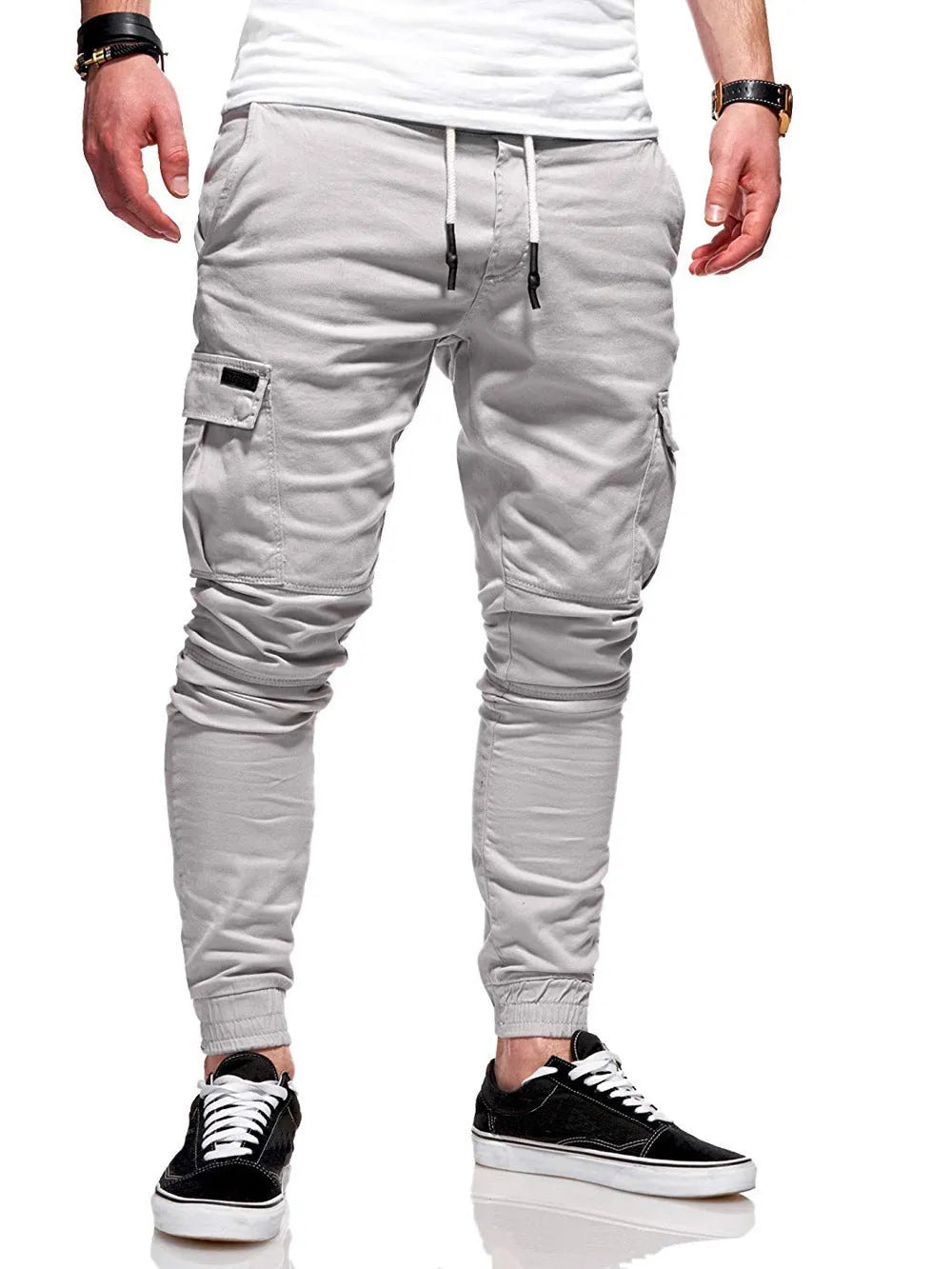 Men's loose-fit polyester casual trousers with elastic waistband and patch pockets in army green colour
