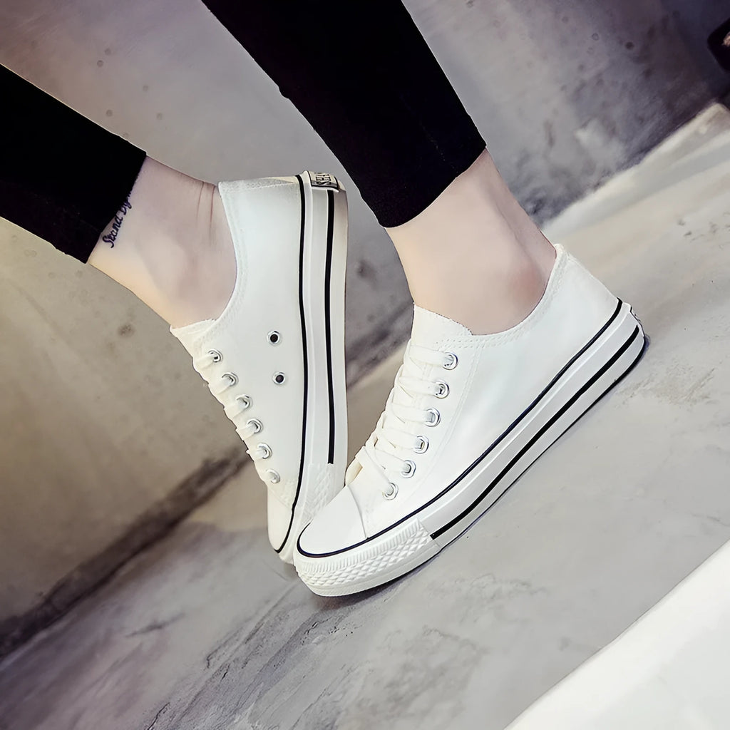 Women's solid colour casual canvas shoe on a white background.
