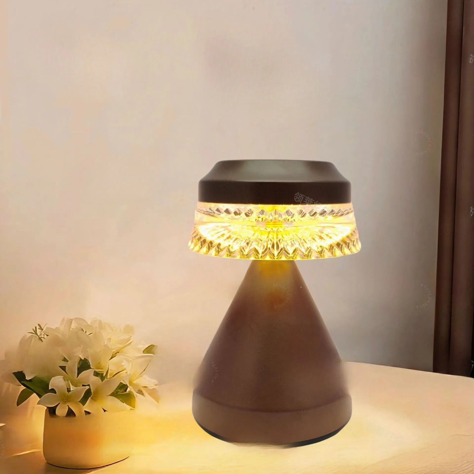 Small minimalist bedside lamp in orange with a USB cable for power.
