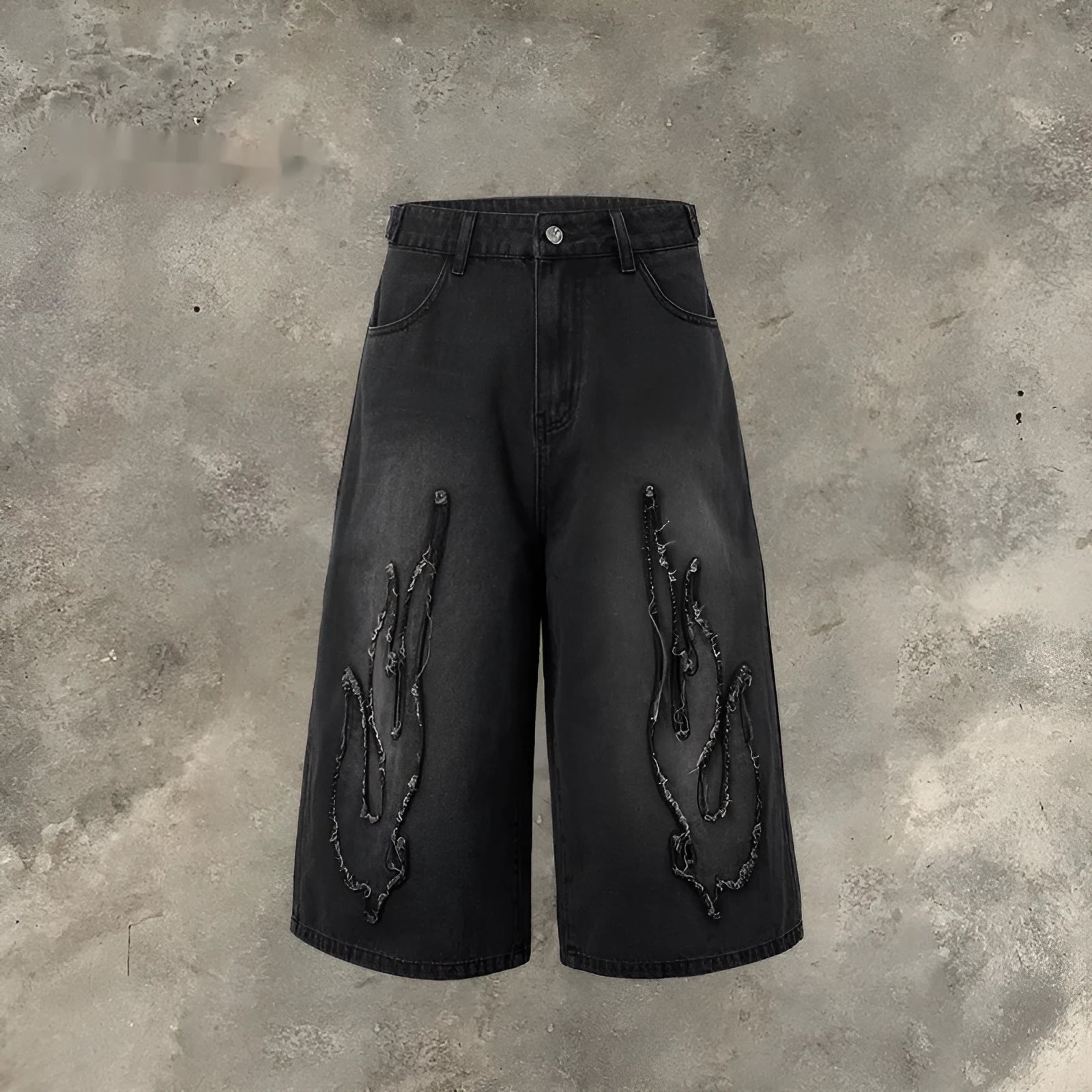 Men's black denim shorts with flame embroidery and cropped patch design on straight-leg cut