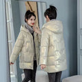 Women's loose fit winter hooded jacket in black colour with regular sleeves