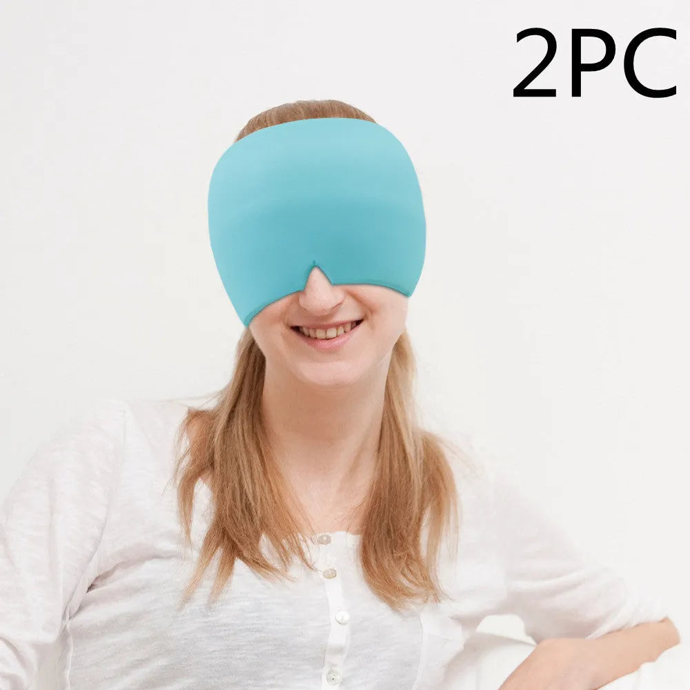 Black elastic cloth gel cold therapy eye mask for headache relief on grey background.