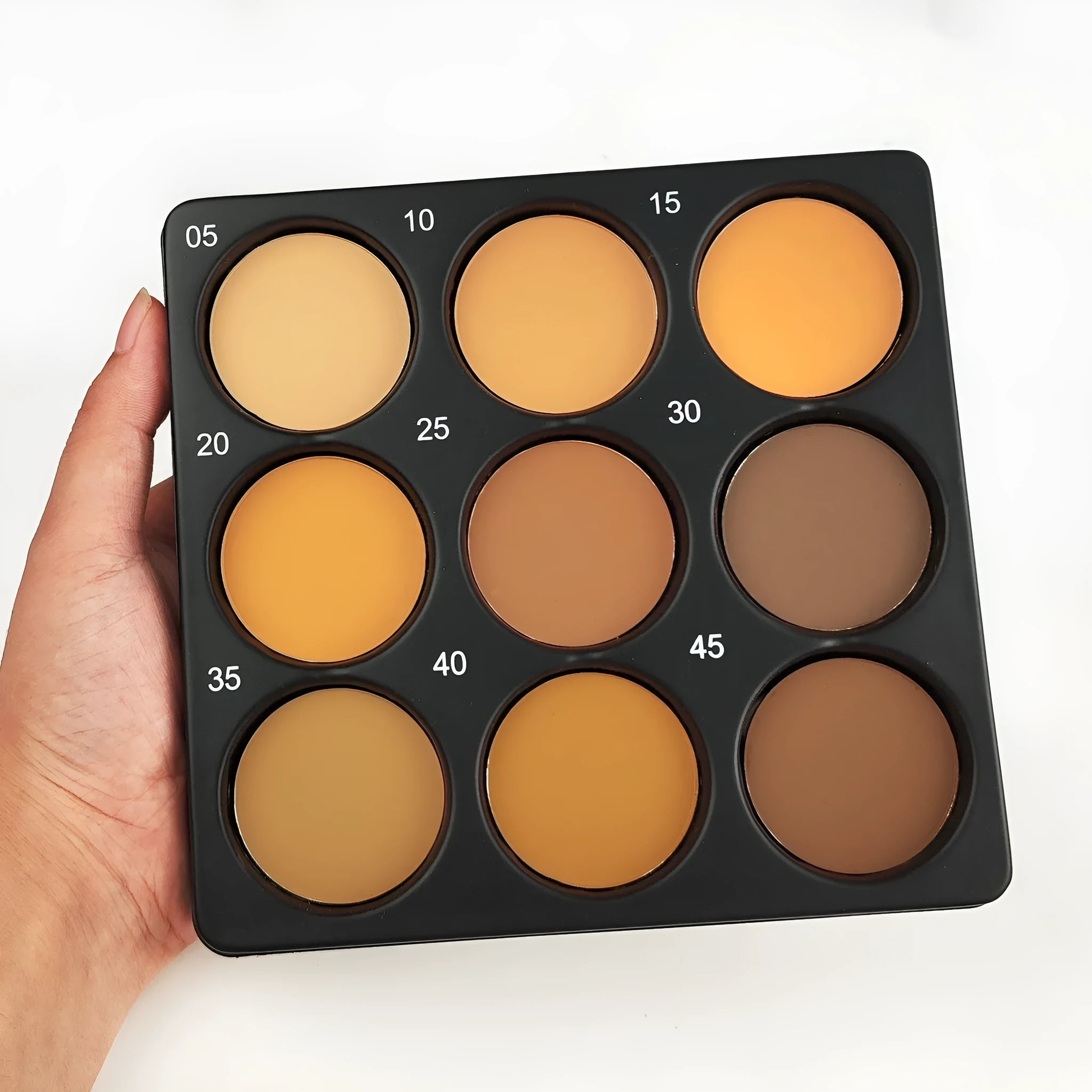 Dark matte eyeshadow palette with nine waterproof shades in a makeup compact