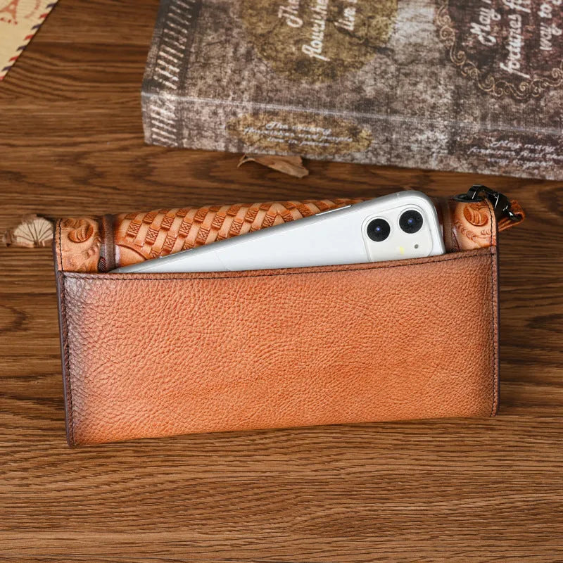 Women's brown tri-fold leather wallet with embossed Chinese floral pattern showing multiple compartments