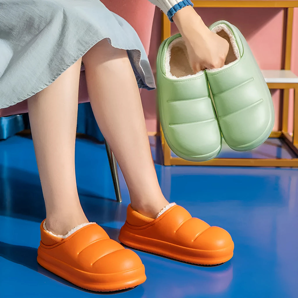 A pair of green EVA couple slippers with plush lining, shown as indoor house shoes and outdoor garden overshoes.