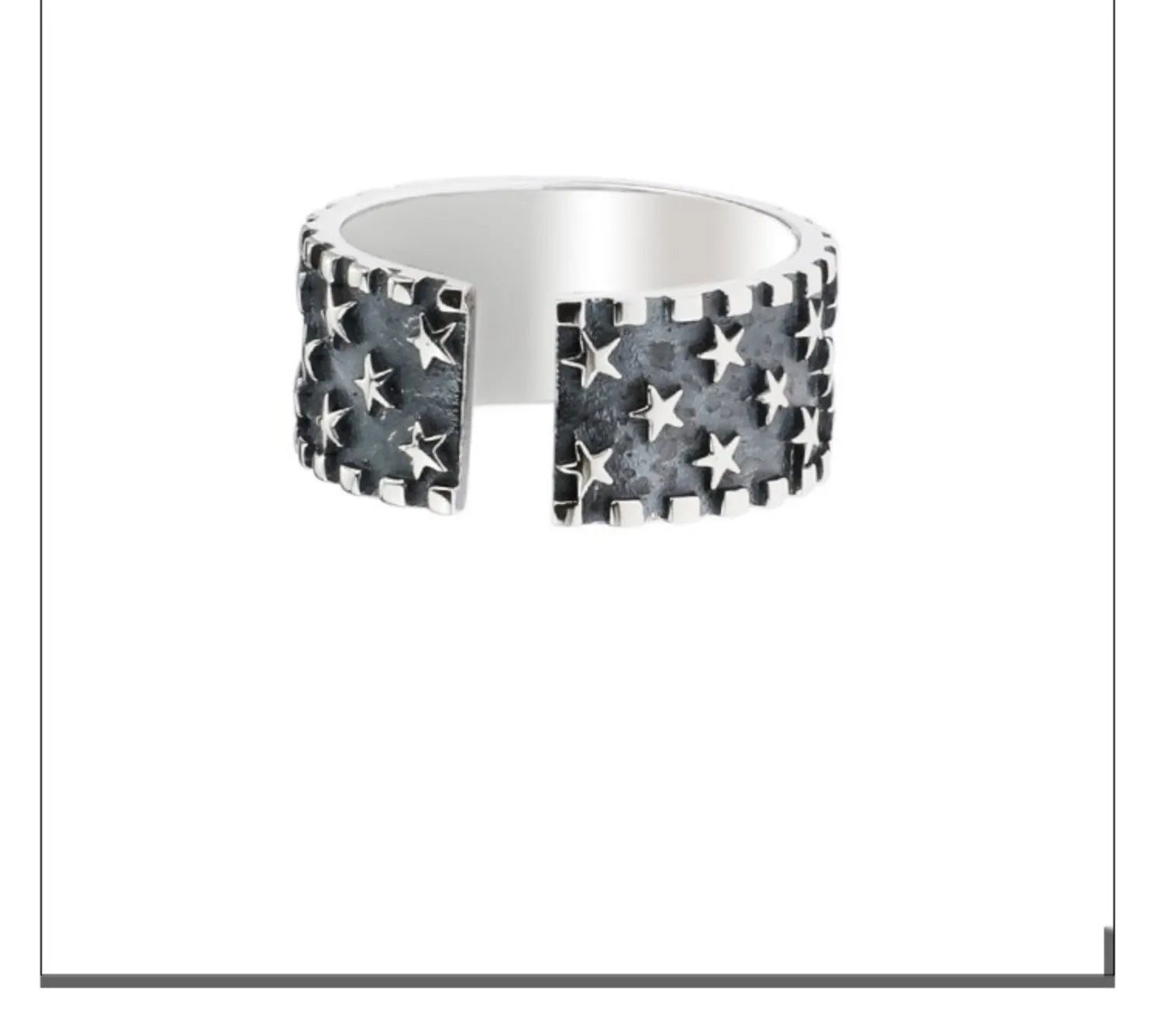 Adjustable open-back sterling silver ring with a raised five-pointed star geometric pattern.