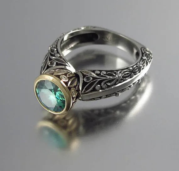 Vintage flower-shaped gemstone ring with gold plating and green silver colour finish showing colour separation design detail