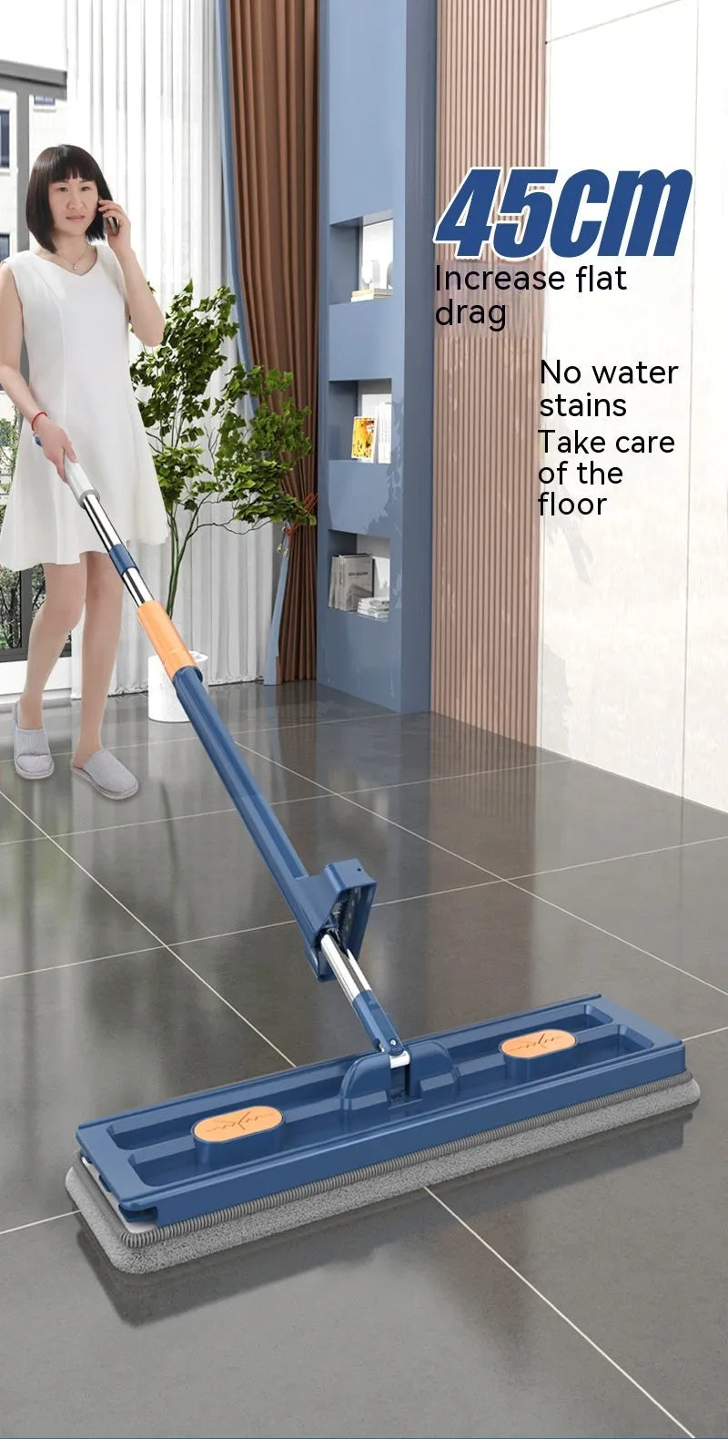 Large flat mop with long stainless steel handle and blue cleaning cloth on a hard floor.