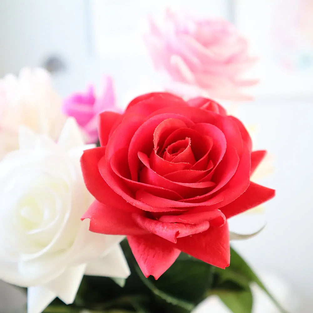 Silk artificial rose bouquet with 8.5cm flower heads in red, orange, white or purple fringe pink colours