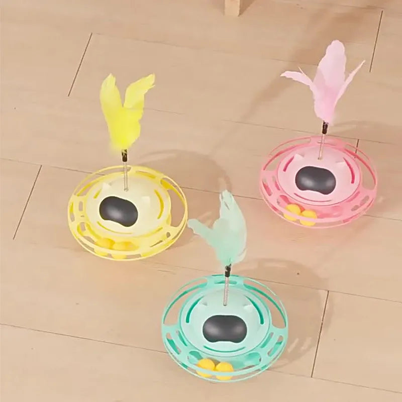 17cm diameter rotating cat toy turntable with ball attachment in pink, blue, yellow, and white colour options