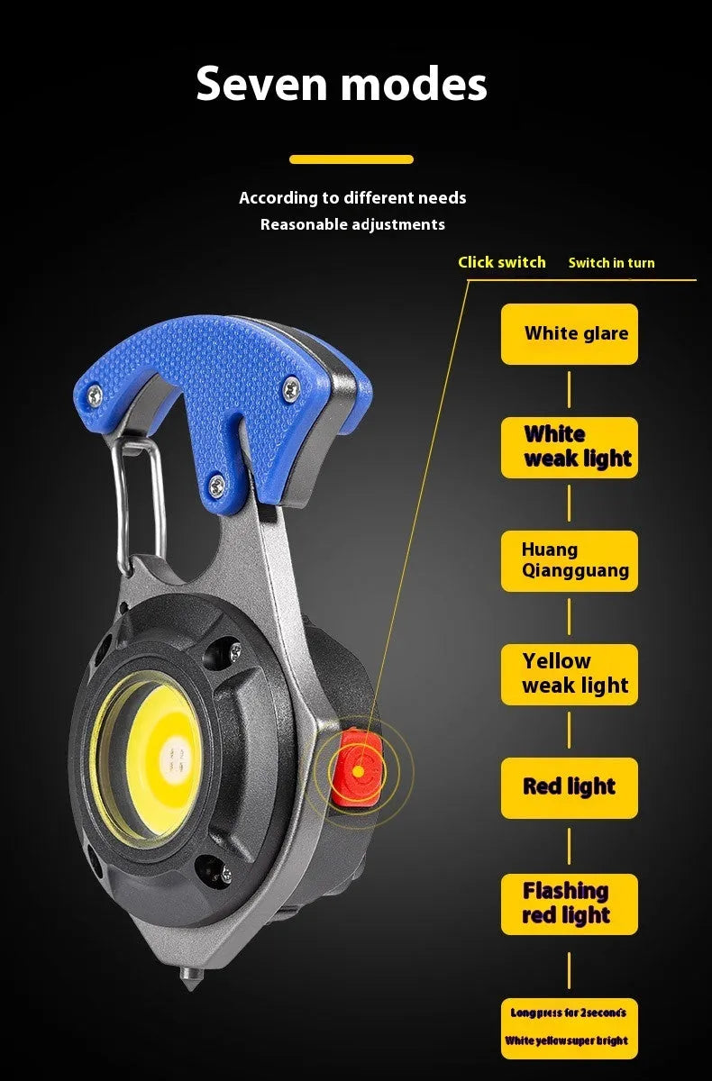 Compact multifunctional keychain torch showing COB light array, keyring, and built-in window breaker and screwdriver tools.