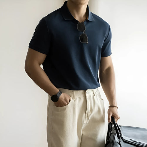 Blue short-sleeved cotton blend polo shirt for men on a hanger, showing regular fit and button placket.