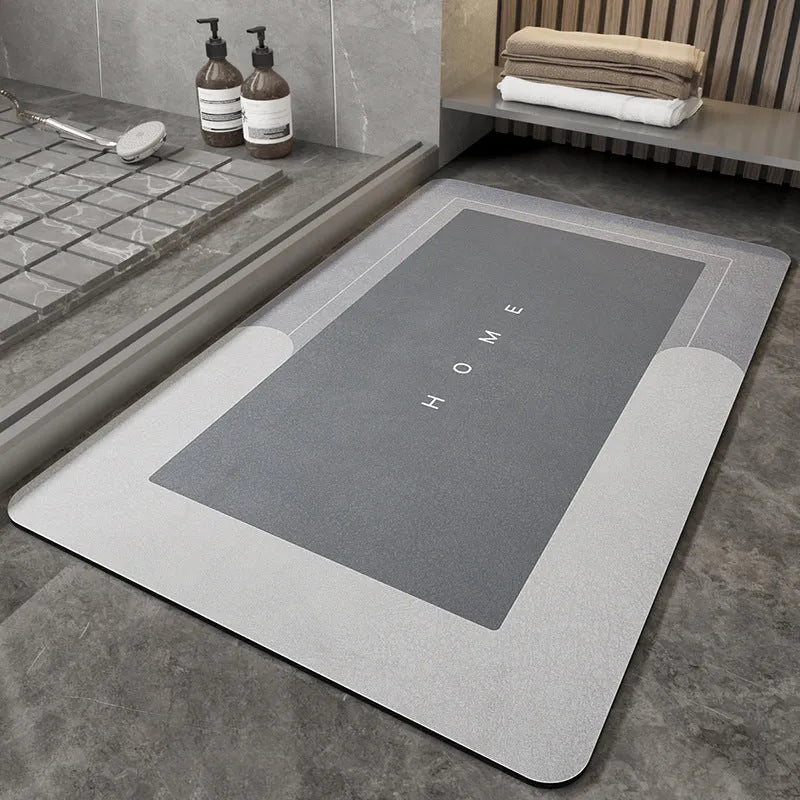 Soft blue oval bathroom floor mat placed on tiles beside a bathtub.