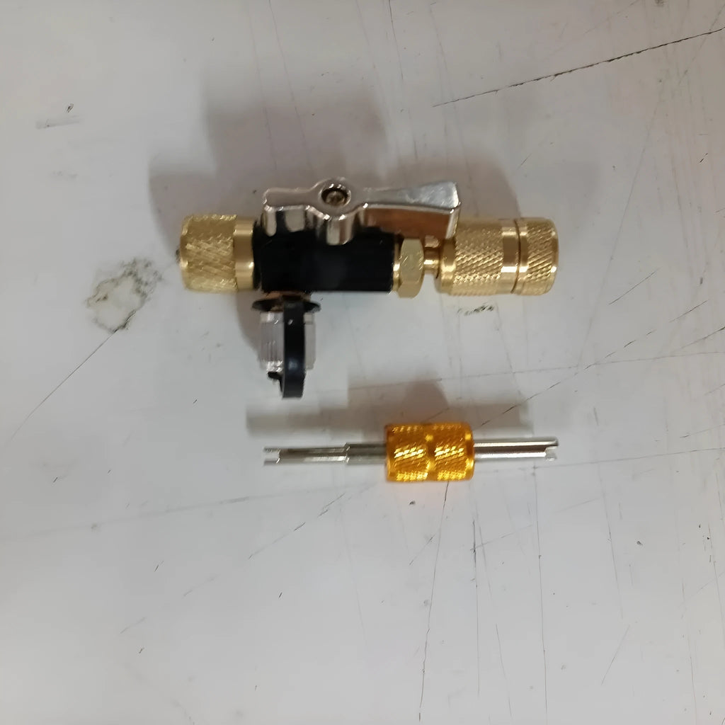 Bicycle tyre valve core disassembly tool set with black and pink removers and a small wrench.
