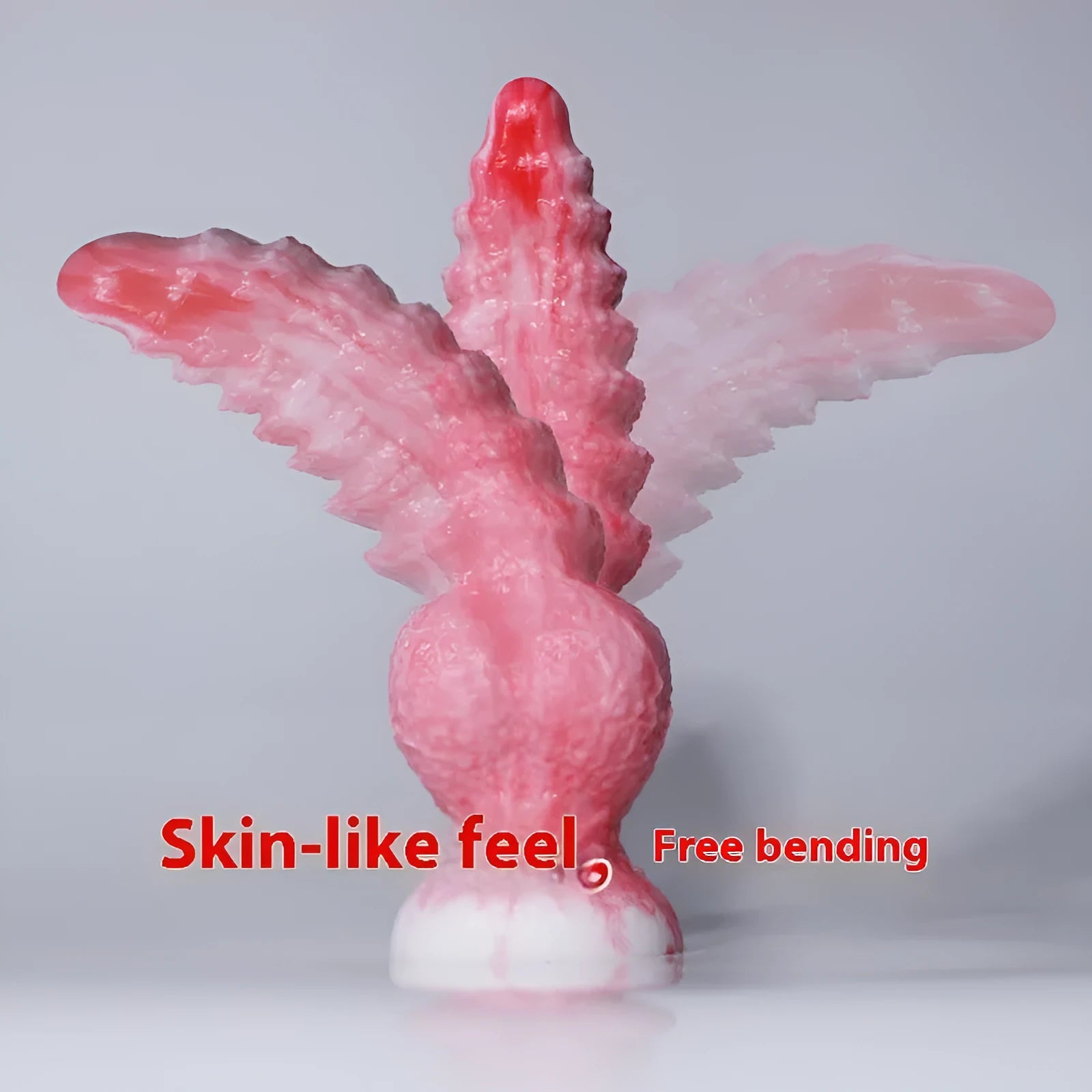 Pink platinum silicone women's masturbation device shaped like a penis