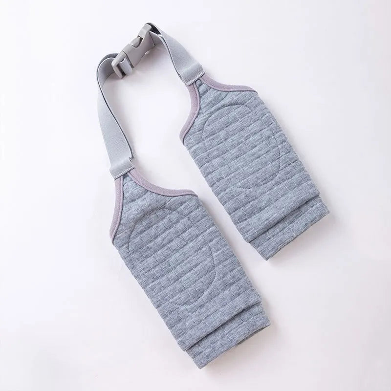 Blue dog elbow support wrap with extra padding and matching scarf on medium-sized dog