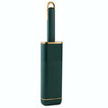 Blue double-sided pet hair remover brush with a storage box base on a fabric sofa.