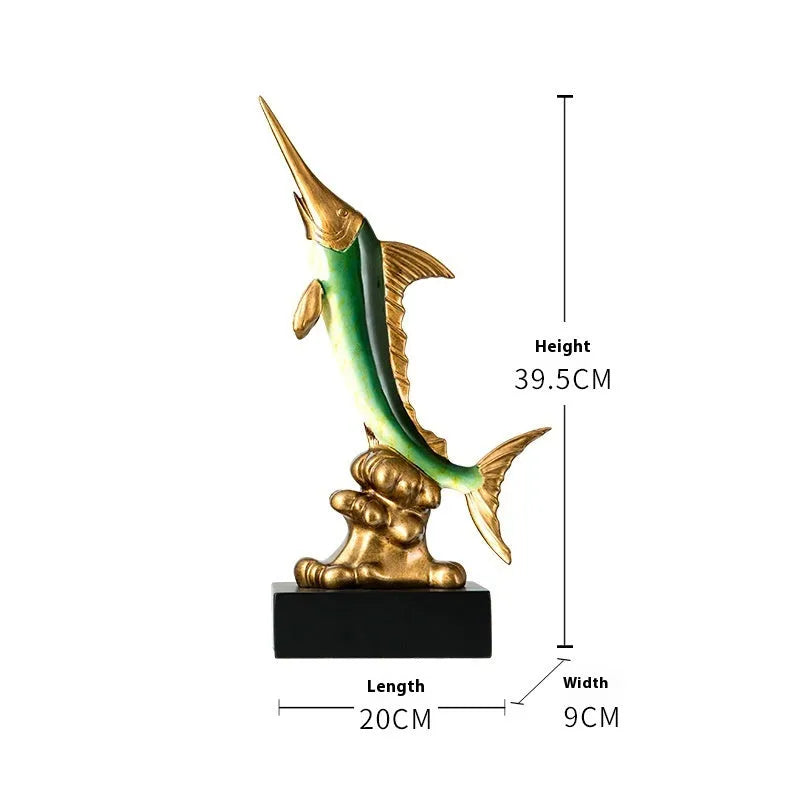 Close-up of a detailed resin European swordfish ornament in bright gold colour on a shelf.