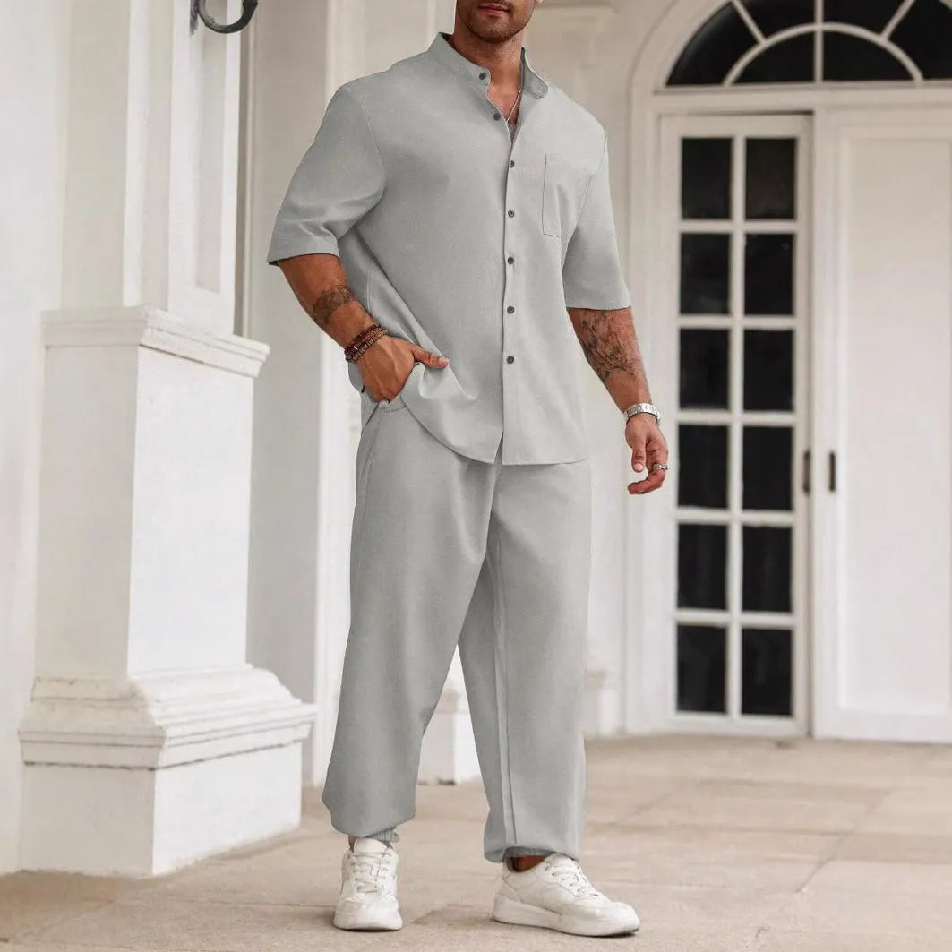 Men's apricot coloured cotton linen casual short-sleeved shirt and trouser set laid flat.