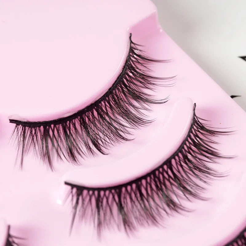 Five pairs of natural wispy false eyelashes on a card for manga anime cosplay and Korean style makeup.